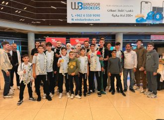 استقبال حافل للعبادي وحماد بعد عودتهما من قطر موشحين بالذهب